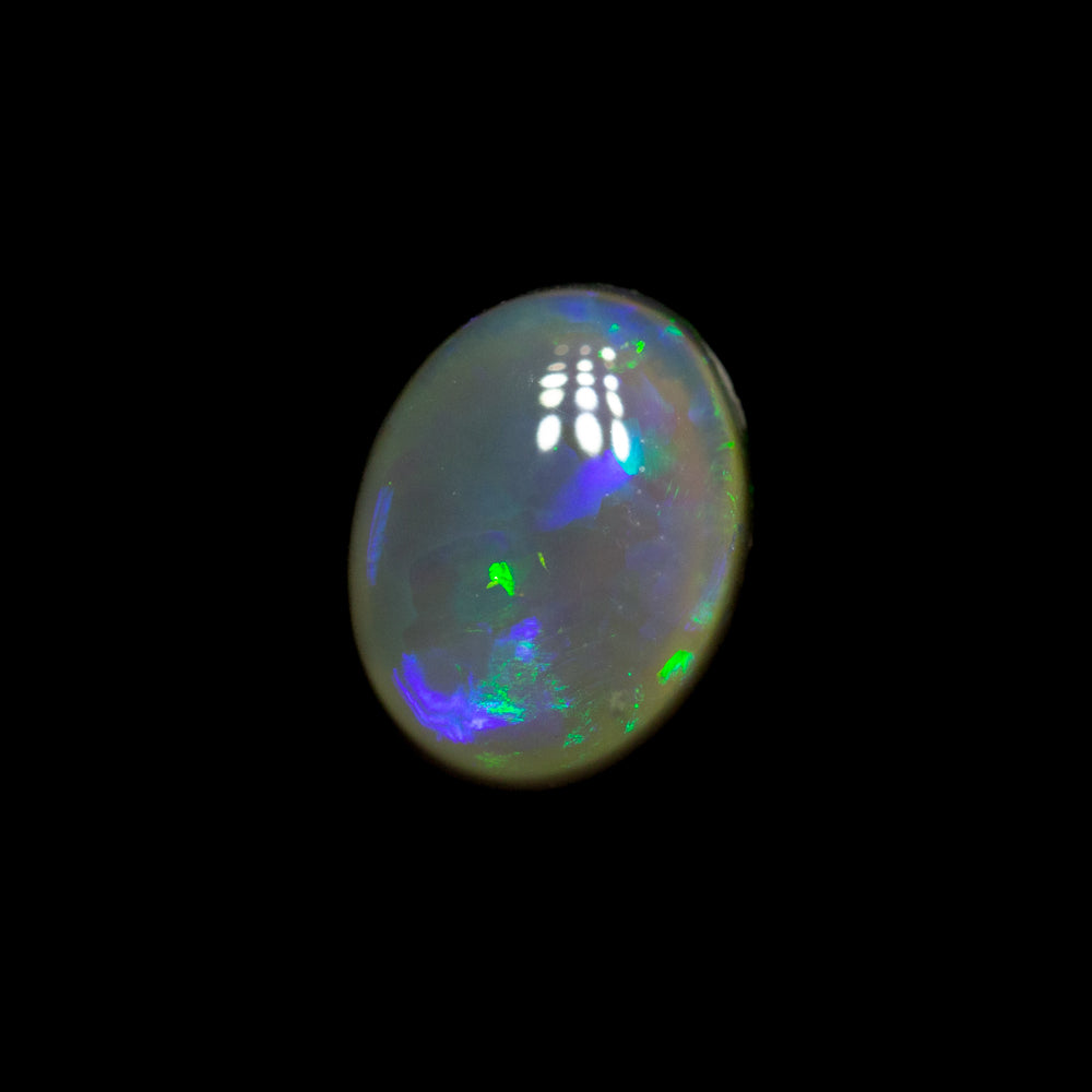 0.81 ct dark crystal opal 7.3x5.7x2.8mm