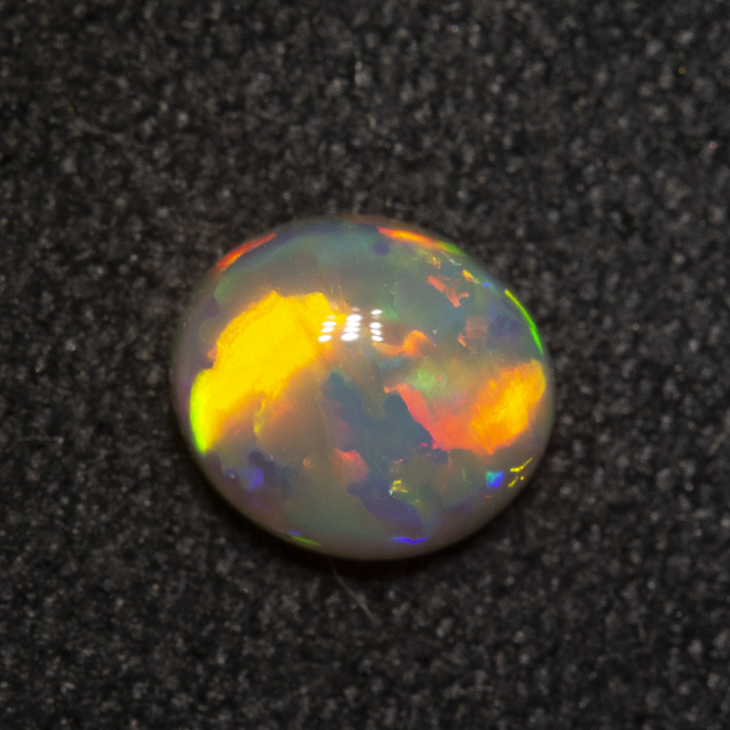 0.81 ct dark opal 8x5.9x2.9mm