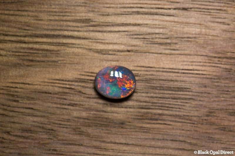 0.81 ct black opal gem 6.5x5x3mm
