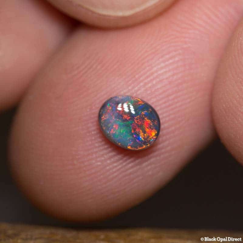 0.81 ct black opal gem 6.5x5x3mm