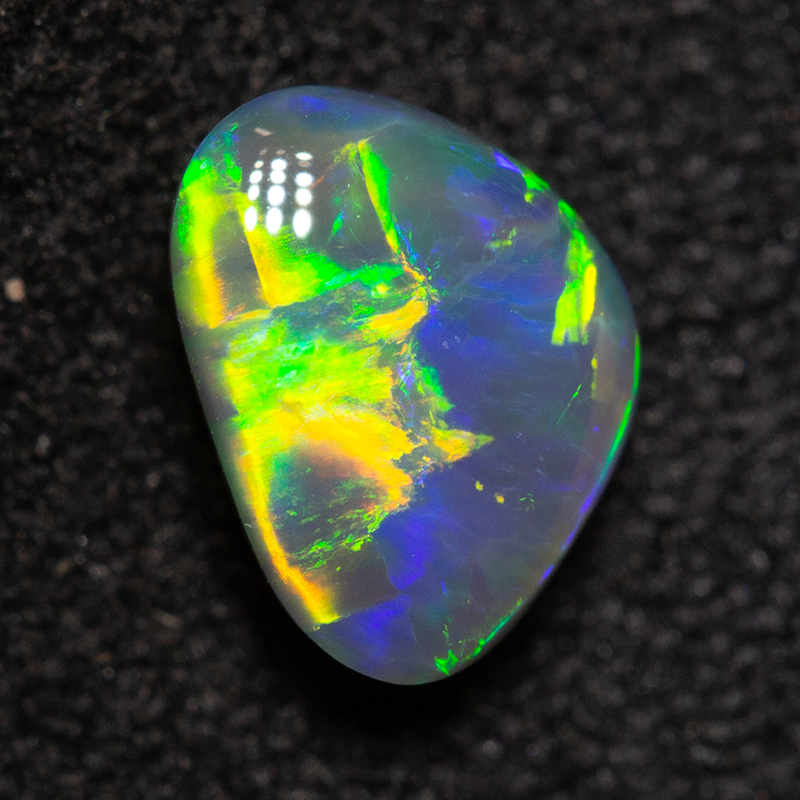 0.82 ct black opal 7.1x5.2x3.3mm