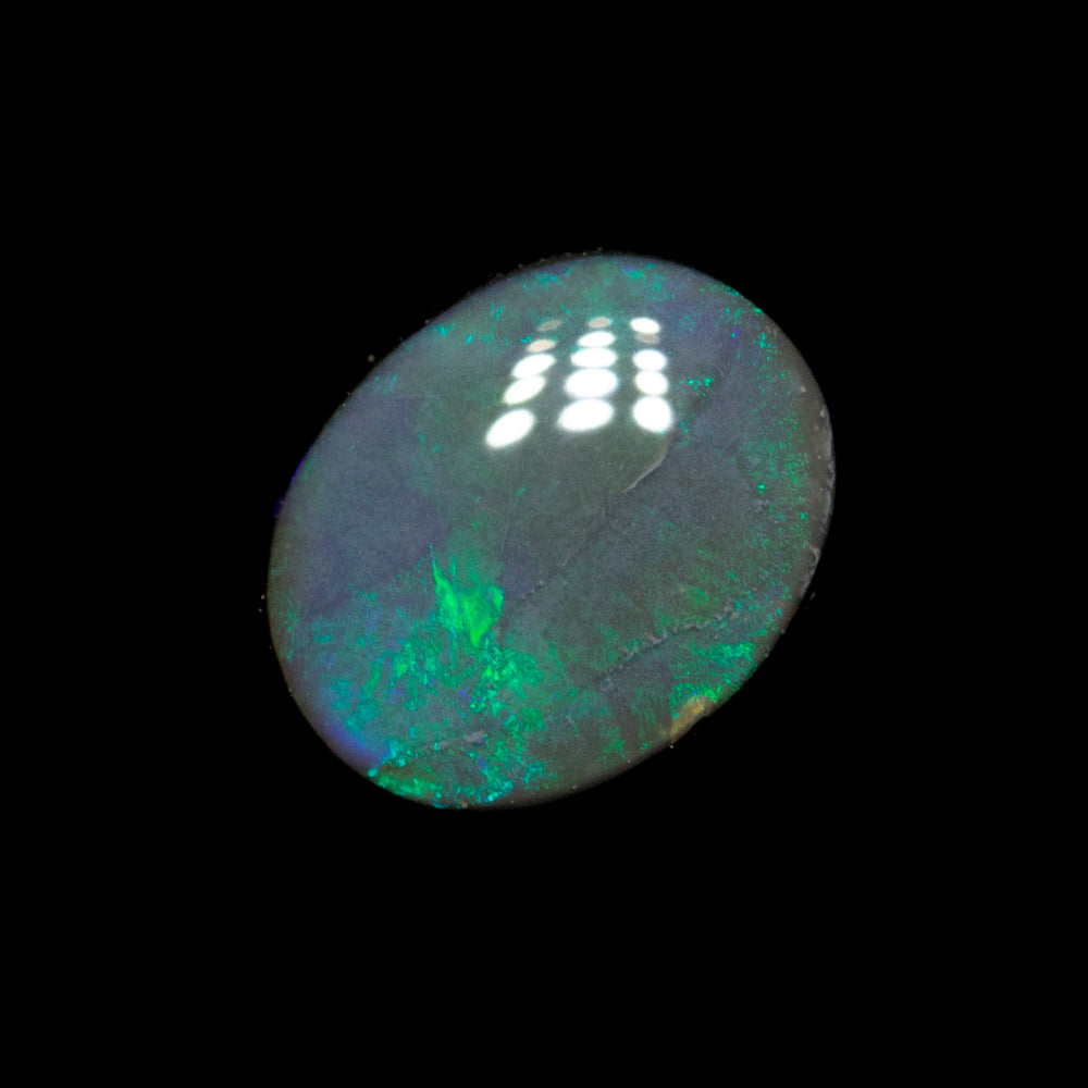 0.82 ct black opal 7.1x5.7x2.8mm