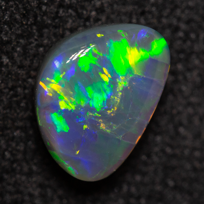 0.82 ct black opal 7.1x5.2x3.3mm