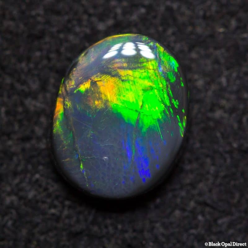 0.82 ct black opal 7x5.5x2mm