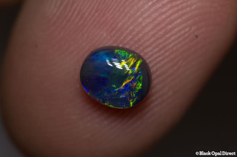 0.82 ct black opal 6.5x6x3mm