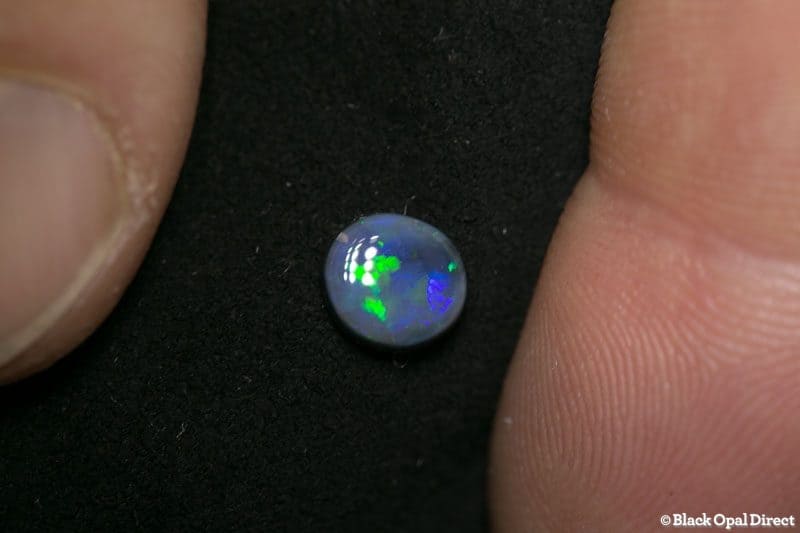 0.82 ct black opal 7x6x2.5mm