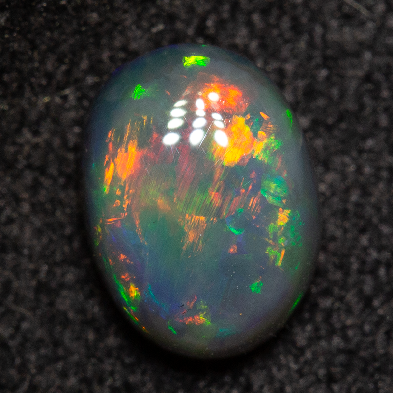 0.83 ct dark opal 6.9x5.1x3.2mm