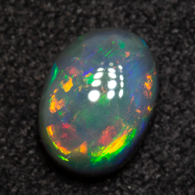 0.83 ct dark opal 6.9x5.1x3.2mm