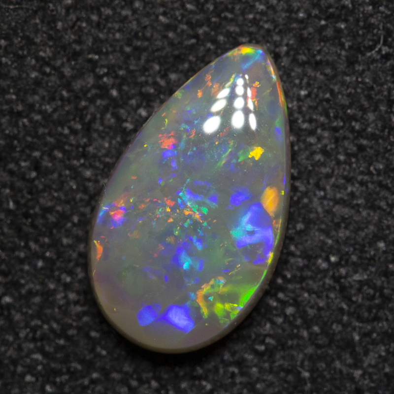 0.84 ct dark opal 9.4x5.5x2.5mm