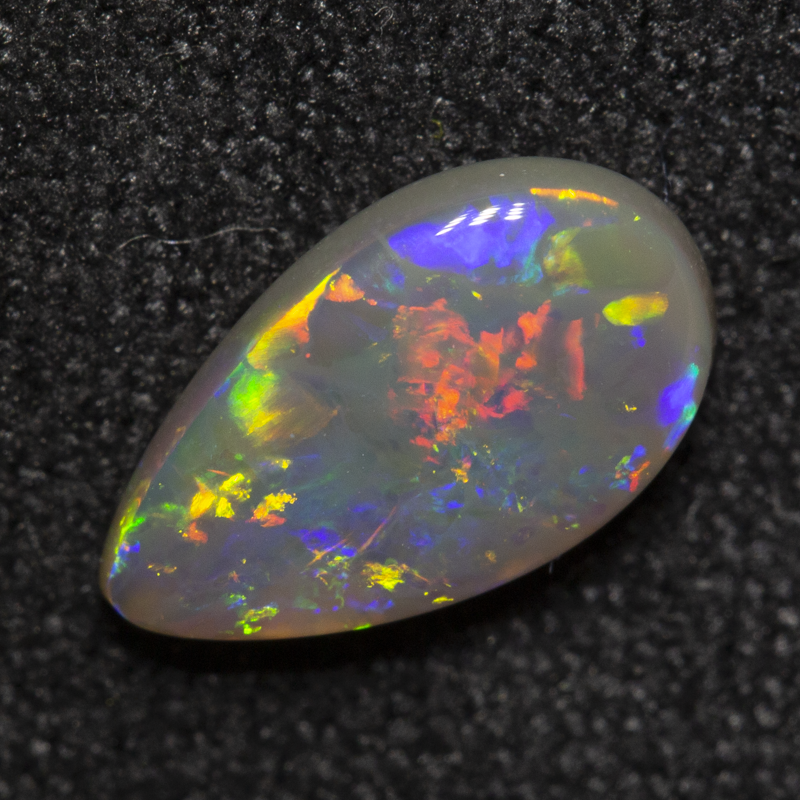 0.84 ct dark opal 9.4x5.5x2.5mm