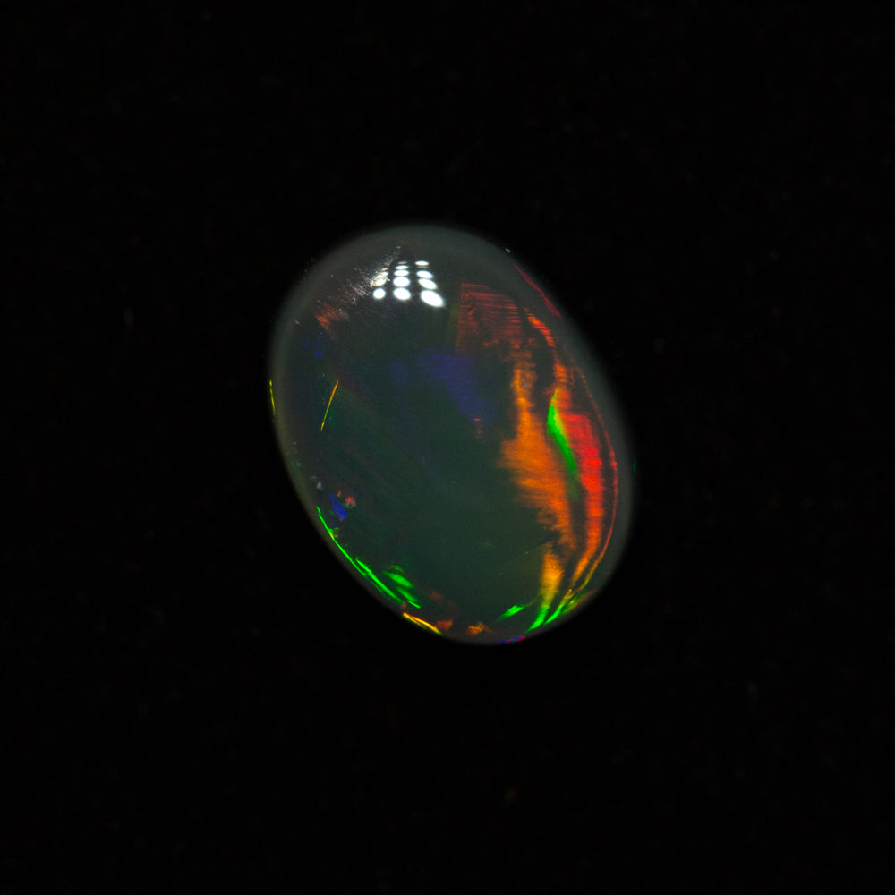 0.84 ct black opal 7.3x5.5x3.2mm