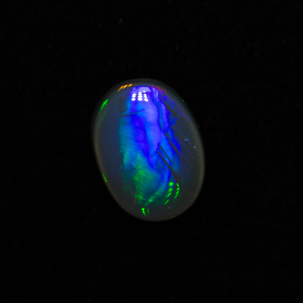 0.84 ct black opal 7.3x5.5x3.2mm