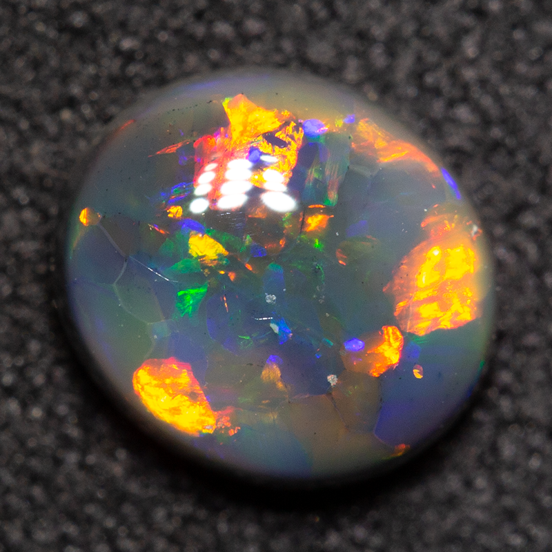 0.85 ct black opal 6.9x6.1x3mm