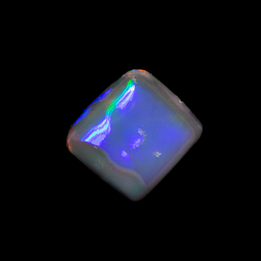 0.85 ct black opal 6.3x5.8x2.8mm