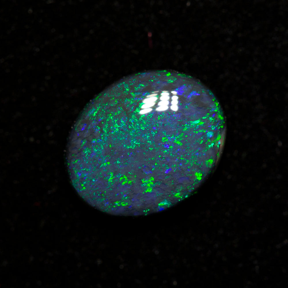 0.85 ct black opal 7.5x6.2x2.8mm