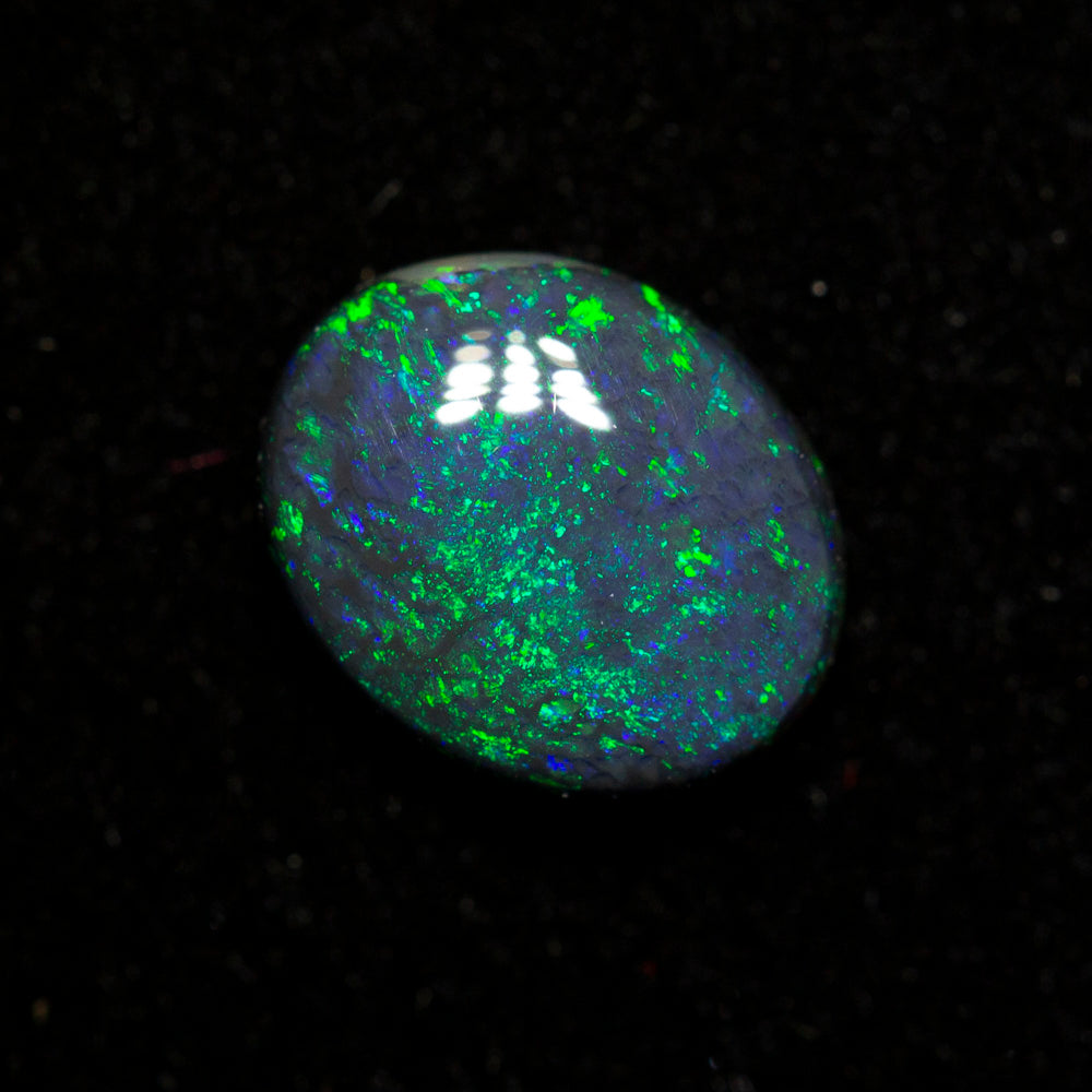 0.85 ct black opal 7.5x6.2x2.8mm