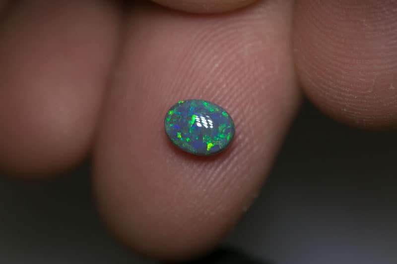 0.85 ct black opal 6.5x5x3mm