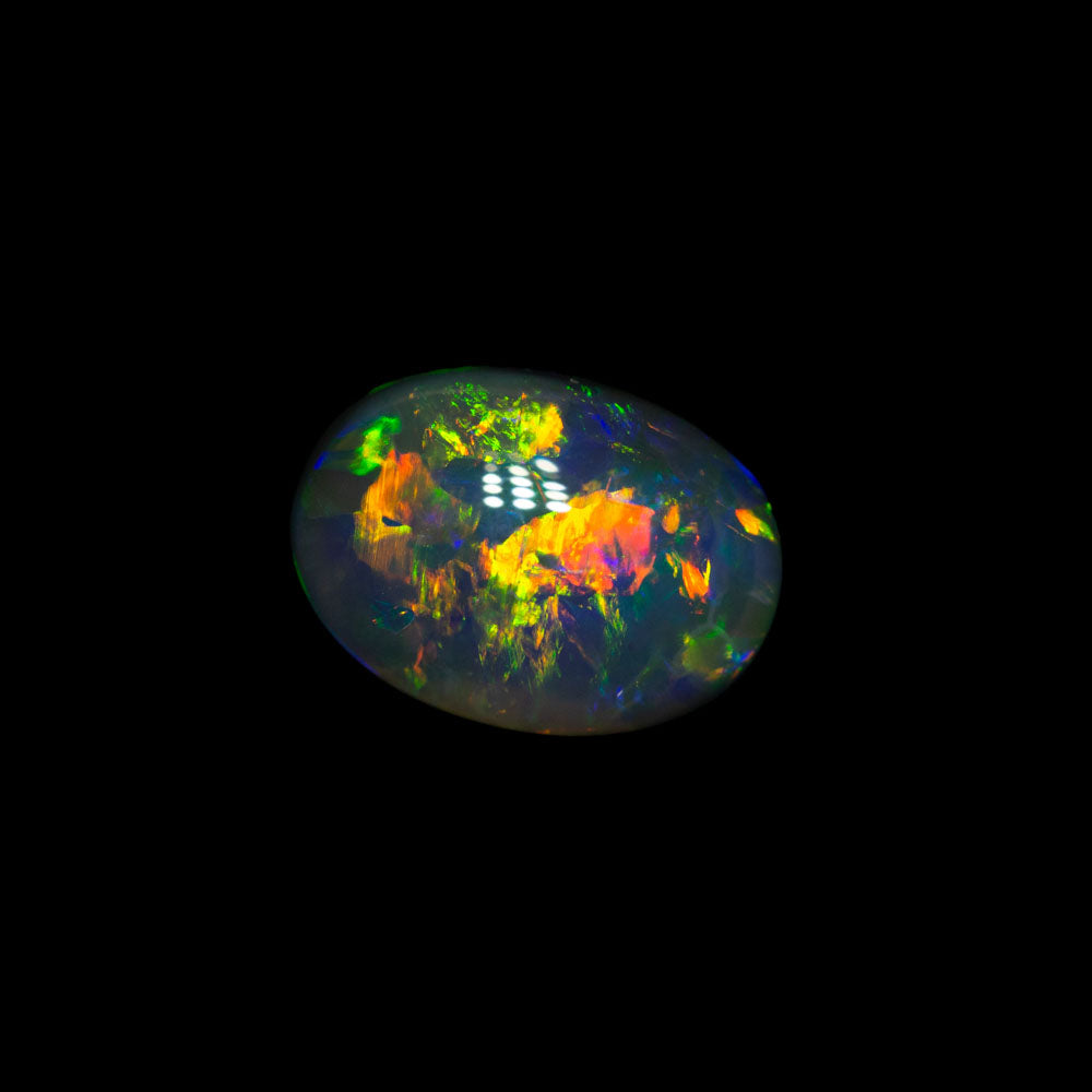 0.86 ct double-sided black opal 8.1x5.8x2.7mm
