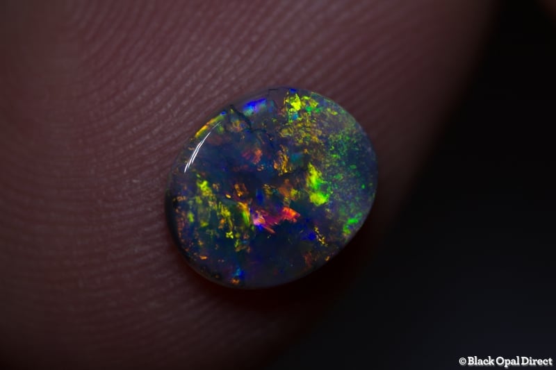 0.87 ct semi black opal 9x7.5x2mm