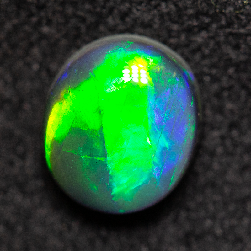 0.88 ct gem black opal 6.5x5.8x3.3m