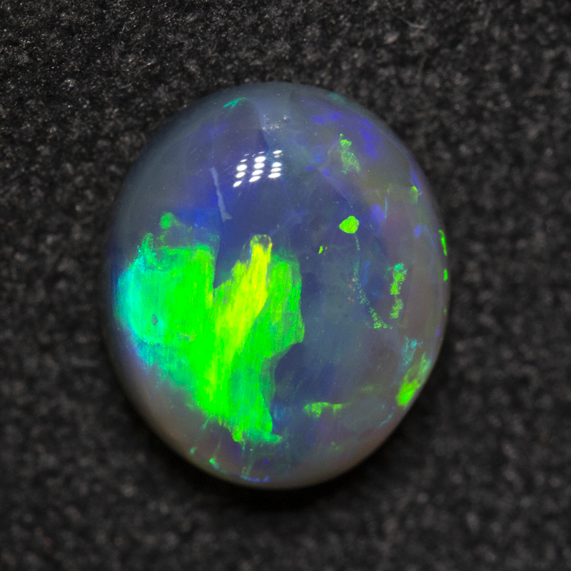 0.88 ct black opal 7x6.1x3.2mm