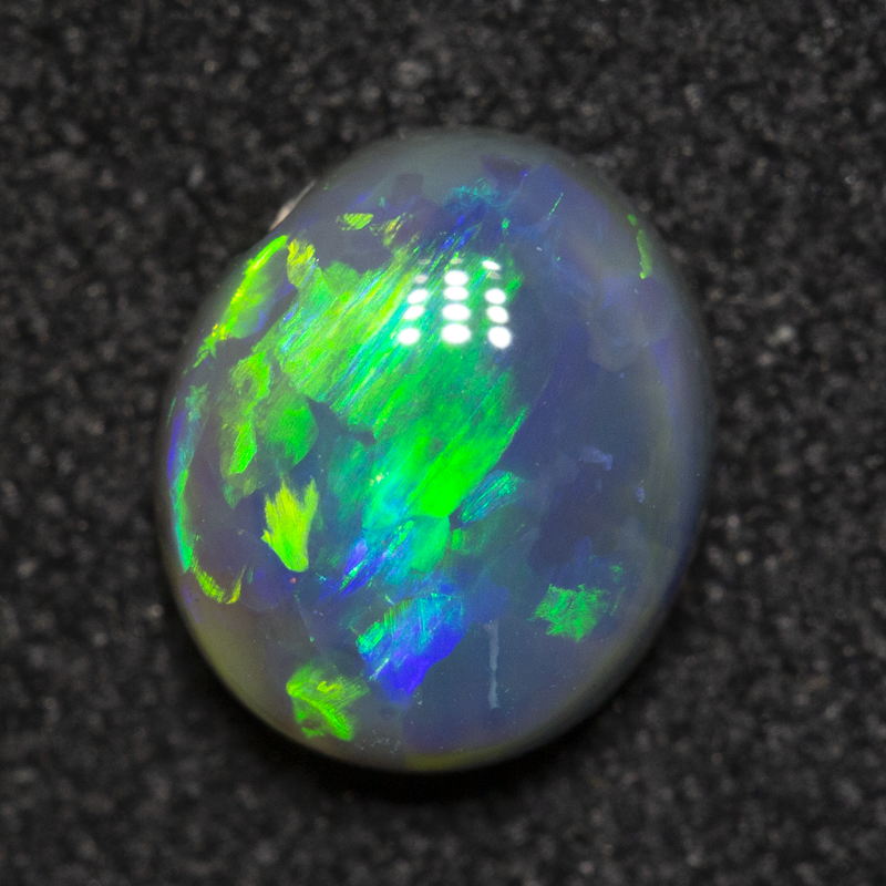 0.88 ct black opal 7x6.1x3.2mm