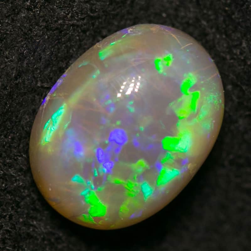 0.88 ct dark opal 7x5x4mm