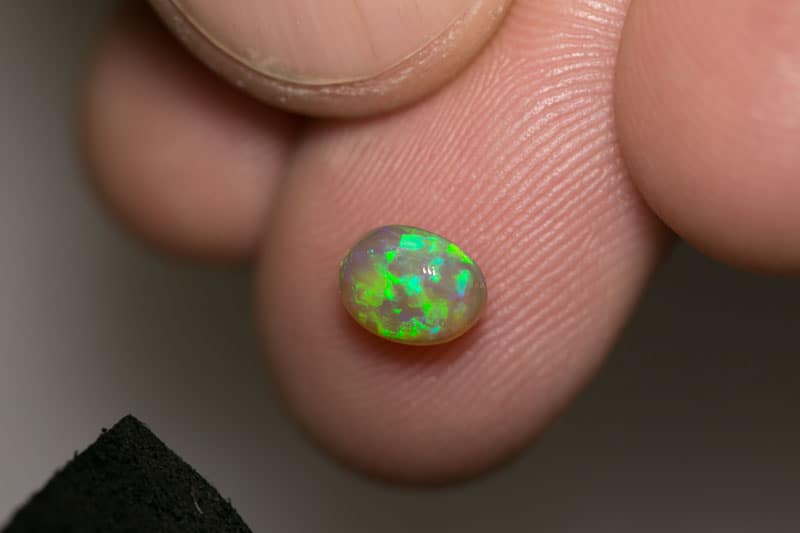 0.88 ct dark opal 7x5x4mm