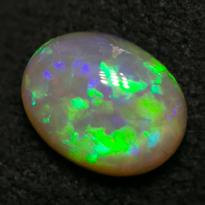 0.88 ct dark opal 7x5x4mm