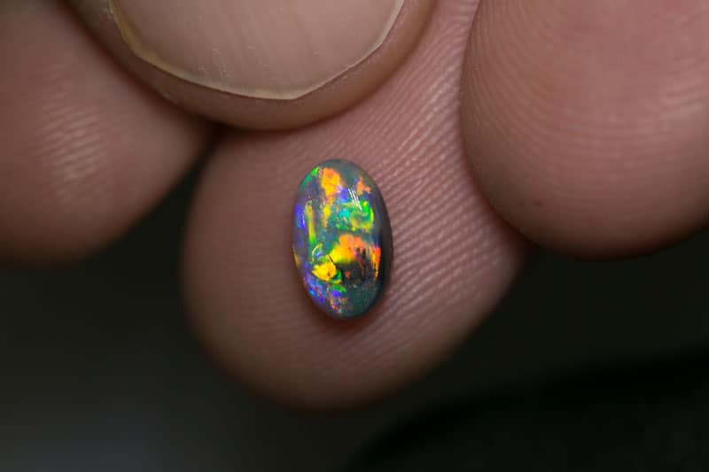 0.88 ct dark opal 8x5x3mm