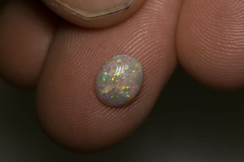 0.91 ct dark opal 8x6.5x2mm