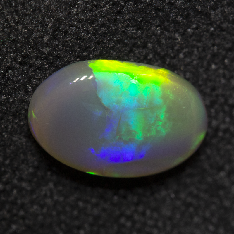 0.93 ct dark opal 9.1x5.9x2.6mm