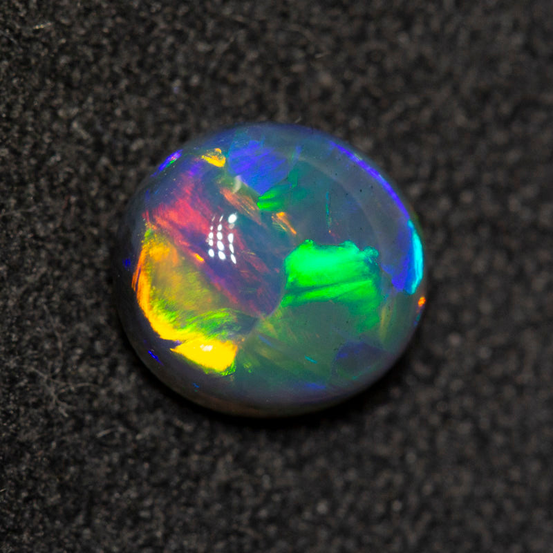 0.95 ct gem black opal 6.9x6.3x3.5mm