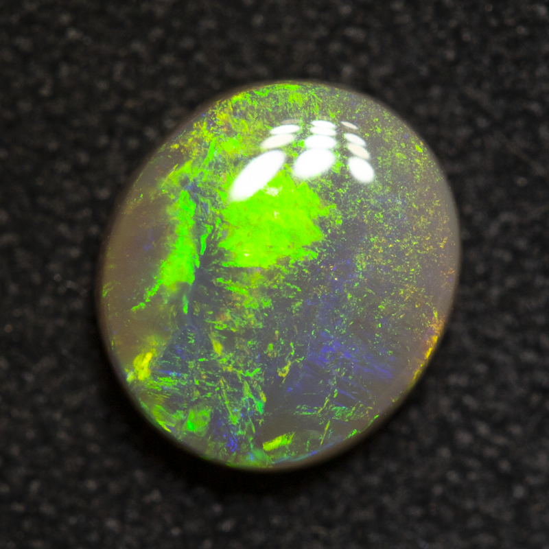 0.96 ct dark opal 7.3x6.5x2.8mm