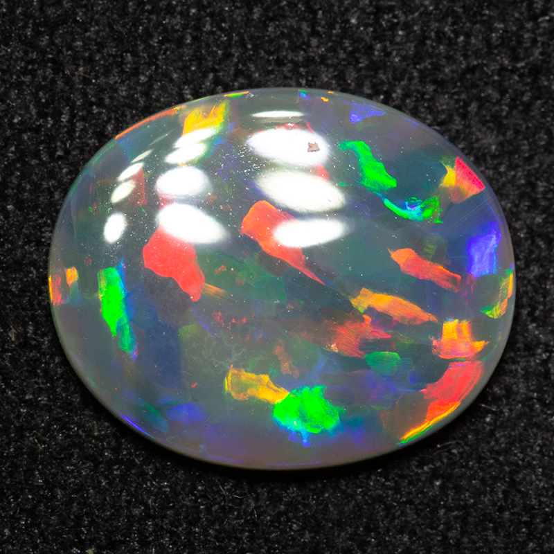 0.98 ct dark opal 10.2x8.4x1.7mm
