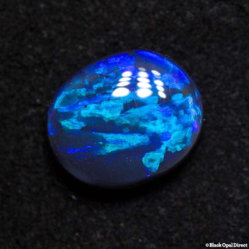 0.98 ct black opal with wedgtail pattern 7.2x6x3mm