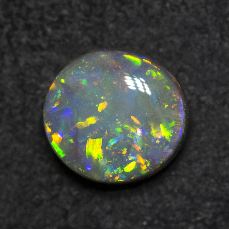 0.99 ct black opal 6.9x6.4x3.6mm