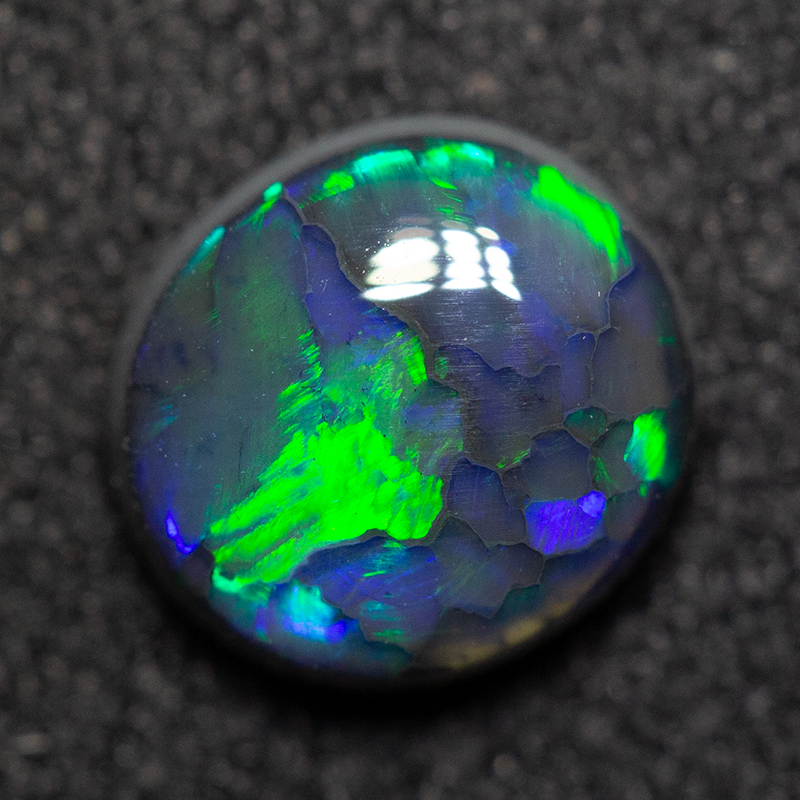 0.99 ct black opal 7.1x6.6x3.3mm