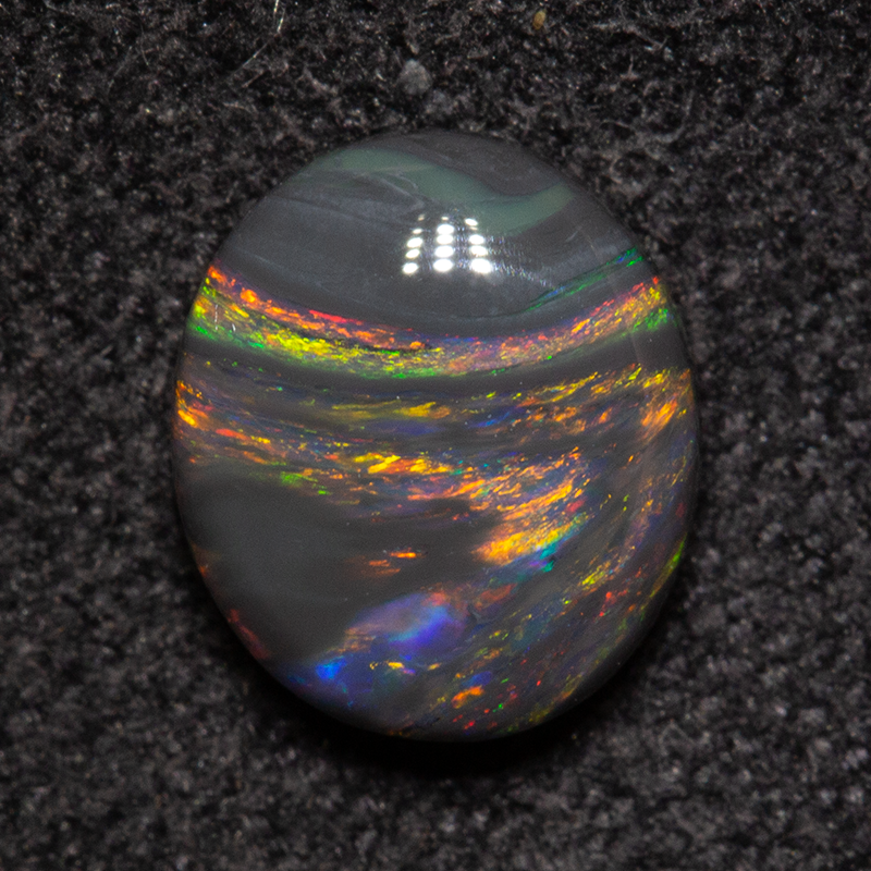 0.99 ct black opal 7.6x6.5x3mm