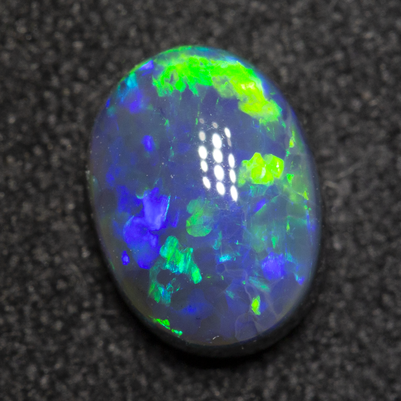 1.00 ct black opal 7.6x5.7x3.7mm