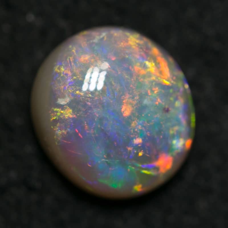 1.03 ct dark opal 7x6x3.5mm