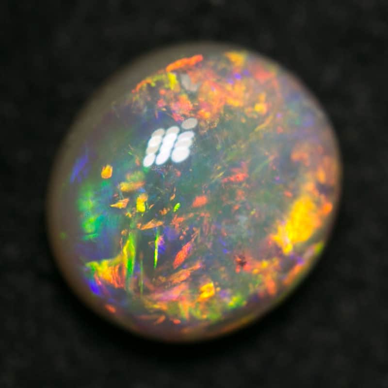 1.03 ct dark opal 7x6x3.5mm