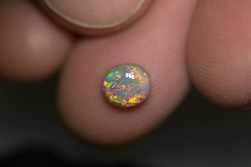 1.03 ct dark opal 7x6x3.5mm