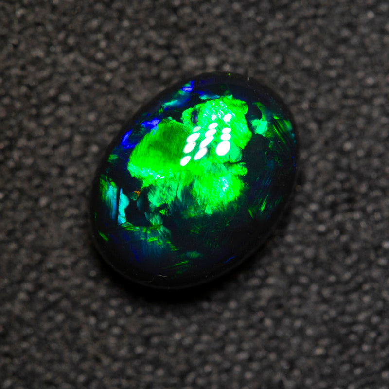 1.06 ct black opal 7.7x5.9x3.8mm