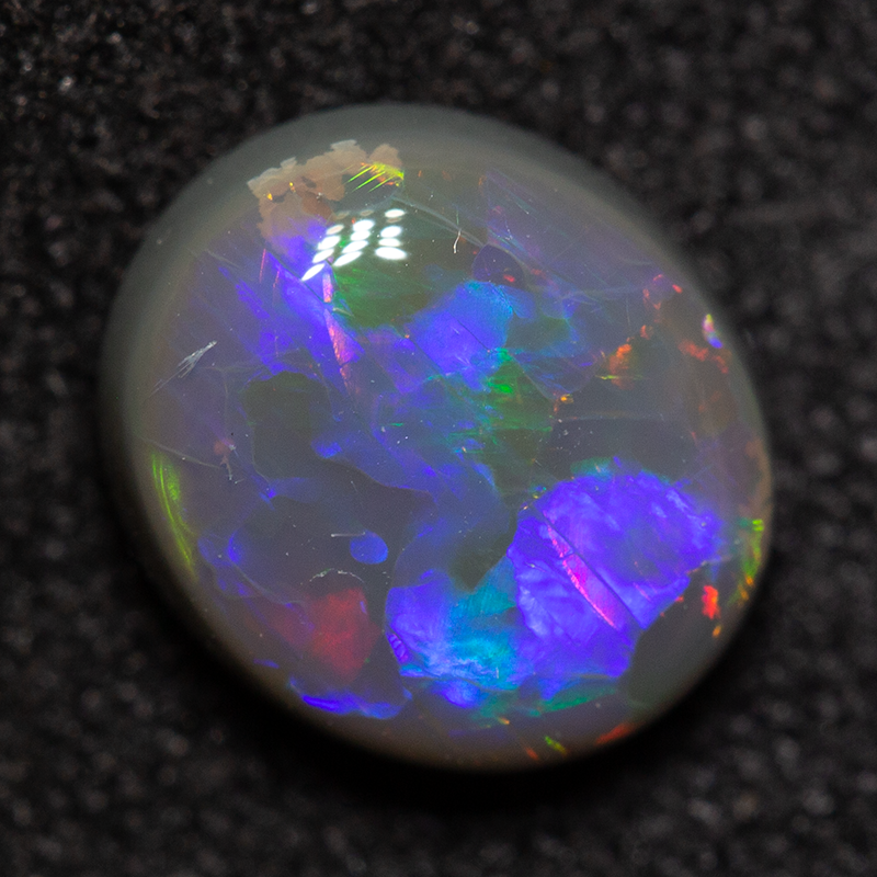 1.26 ct black opal 7.7x6.8x3.6mm