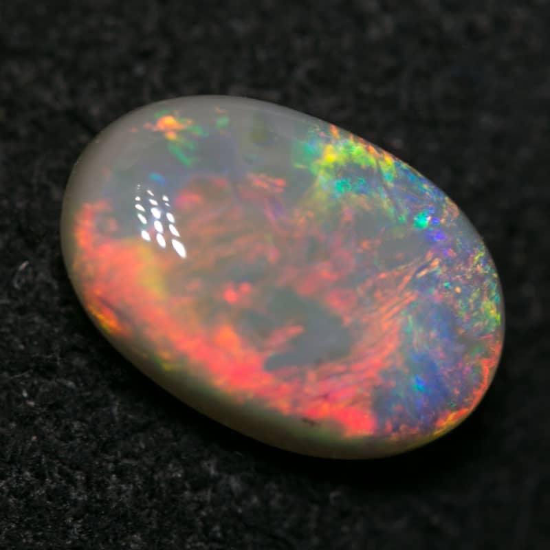 1.26 ct dark opal 9x6x3mm