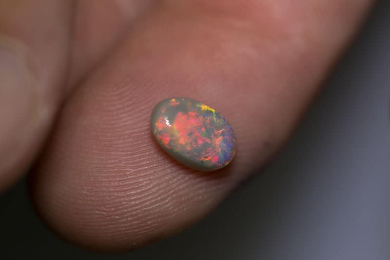 1.26 ct dark opal 9x6x3mm
