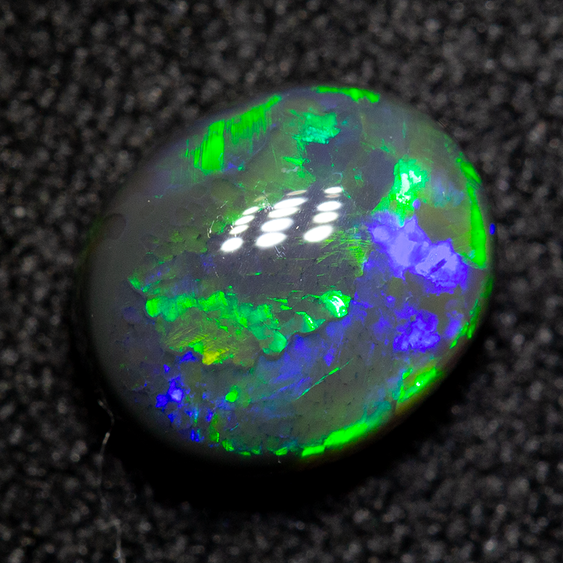 1.30 ct black opal 7.5x6.5x4mm