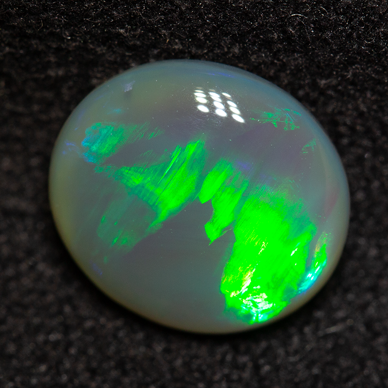 1.37 ct dark opal 8.7x7.8x3.4mm
