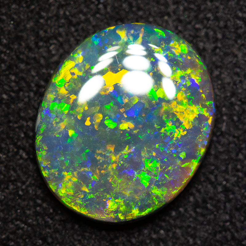 1.38 ct black opal 9.6x8.1x2.4mm